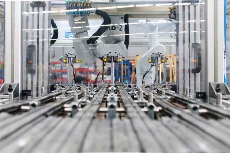 ABB robot performing precision assembly automation at AMD Automation facility